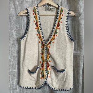 Beautiful vest with a super cute beaded pattern.